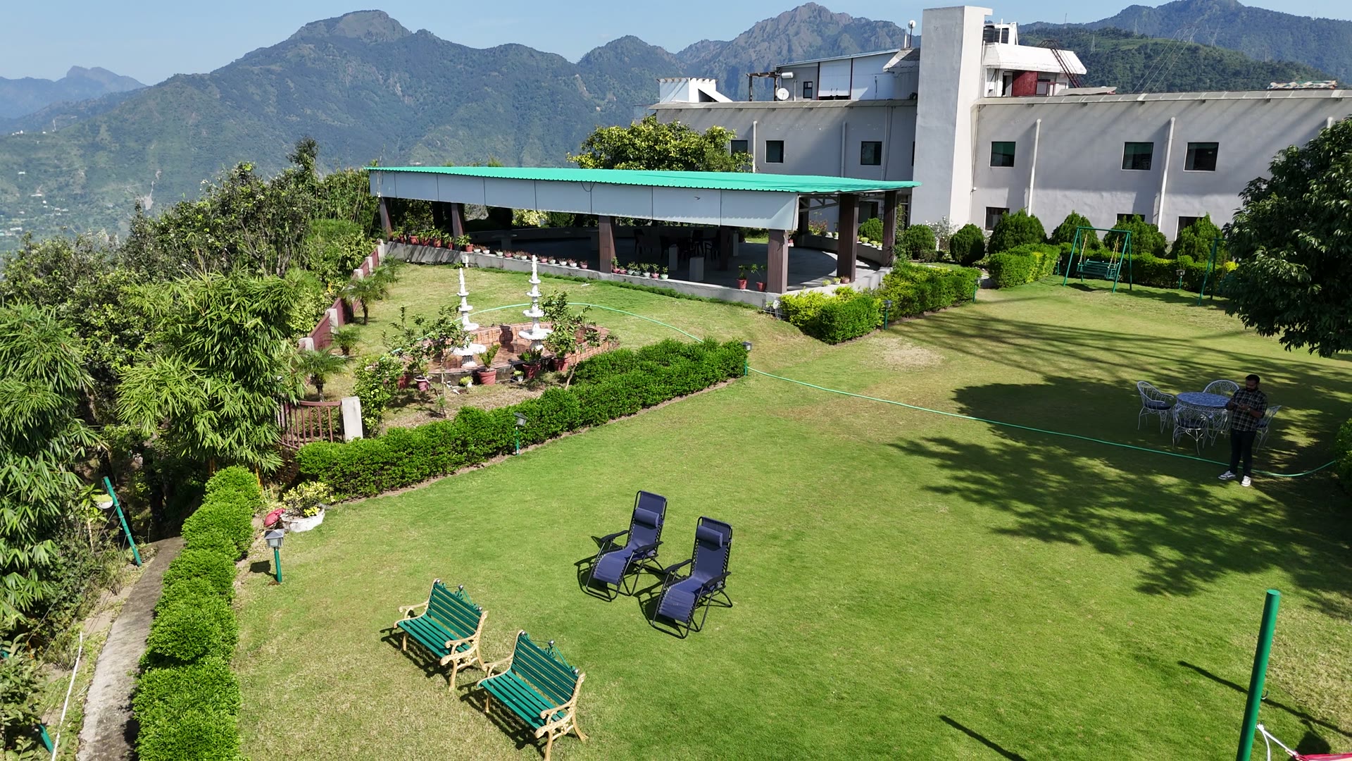 Aerial view of the Nirvanta hilltop estate with the Himalaya behind